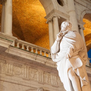 Night view of the statue of the famous renaissance architect Palladio and part of the Palladian basilica